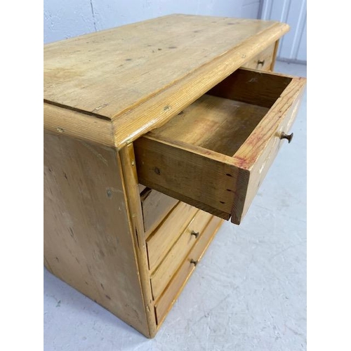 219 - Small Pine collectors cabinet of two small drawers over four long with metal stud handles approx 66 ... 