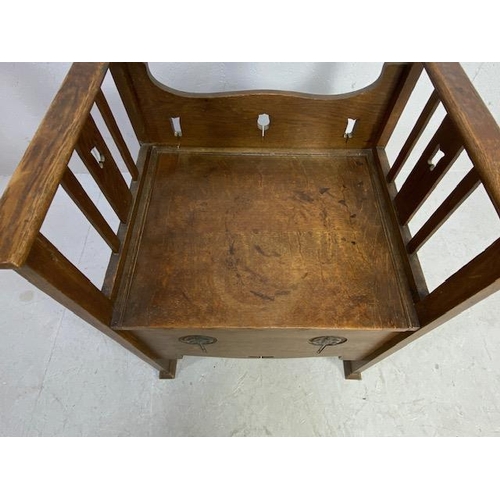 220 - Arts and Crafts commode chair with carvings and pierced decoration and original ceramics