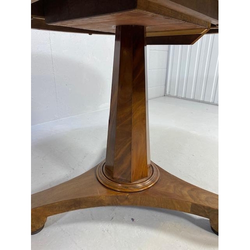 226 - Circular tilt top table on pedestal base and tripod feet, approx 106cm in diameter