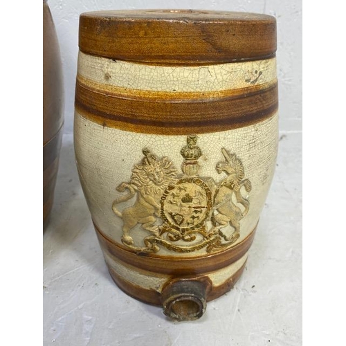 236 - Salt glazed barrels, one approximately 42cm high, the other embossed with royal coat of arms approxi... 