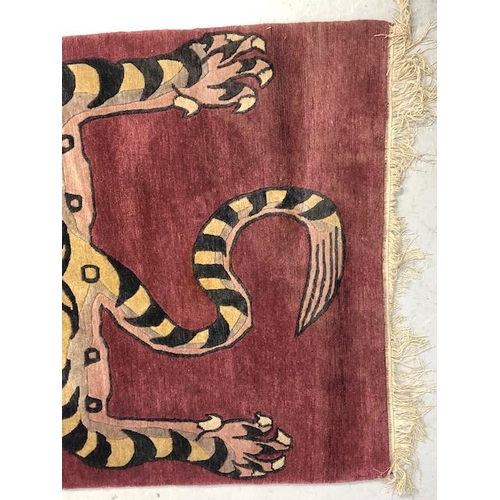 274 - Oriental Rugs, Chinese or Tibetan tiger rug, hand knotted wool, tiger set against a magenta back gro... 