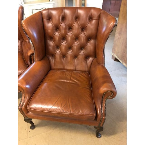 282 - Vintage three piece leather suite,  comprising of button wing back 2 seater sofa and a  pair of matc... 