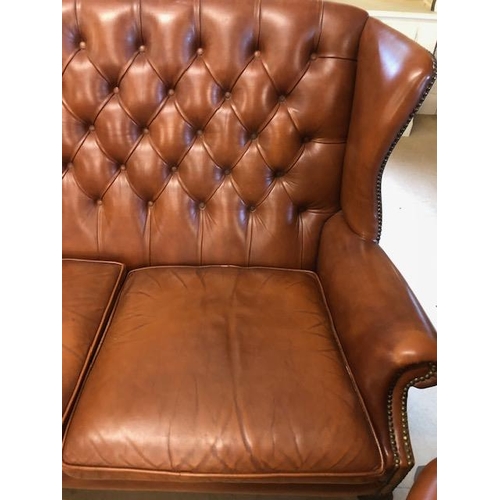 282 - Vintage three piece leather suite,  comprising of button wing back 2 seater sofa and a  pair of matc... 