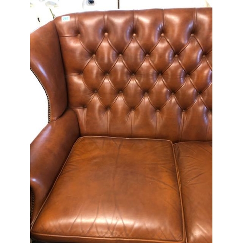 282 - Vintage three piece leather suite,  comprising of button wing back 2 seater sofa and a  pair of matc... 