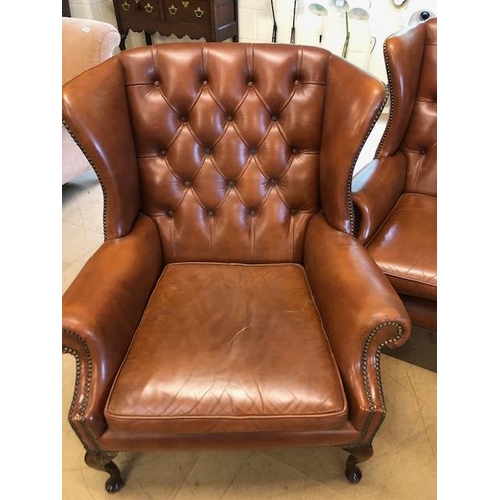 282 - Vintage three piece leather suite,  comprising of button wing back 2 seater sofa and a  pair of matc... 