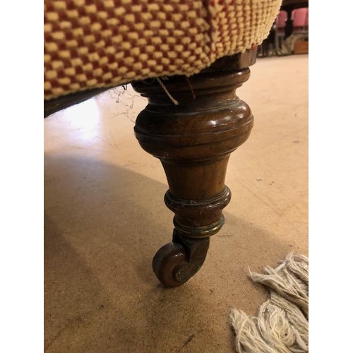 283 - Antique furniture, Howard style deep seated  arm chair, turned front legs with brass casters, has be... 