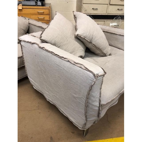 291 - Modern two seater sofa and matching arm chair by Designers Guild, with reverse  seam covers on metal... 