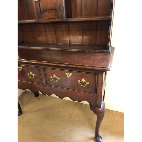 301 - Antique furniture, 19th century oak dresser, on cabriolet legs, two drawer base with three shelf top... 