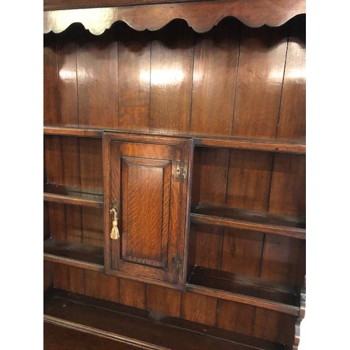 301 - Antique furniture, 19th century oak dresser, on cabriolet legs, two drawer base with three shelf top... 