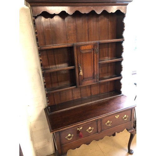 301 - Antique furniture, 19th century oak dresser, on cabriolet legs, two drawer base with three shelf top... 