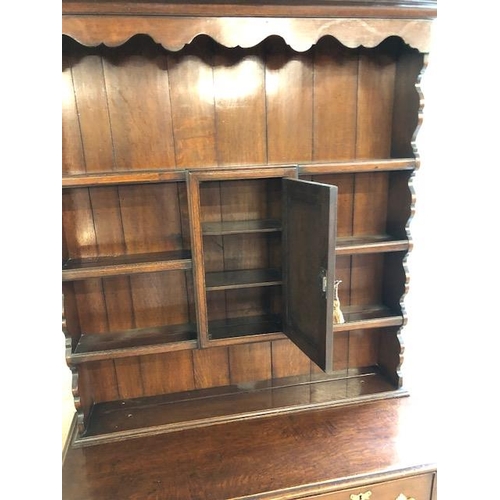 301 - Antique furniture, 19th century oak dresser, on cabriolet legs, two drawer base with three shelf top... 