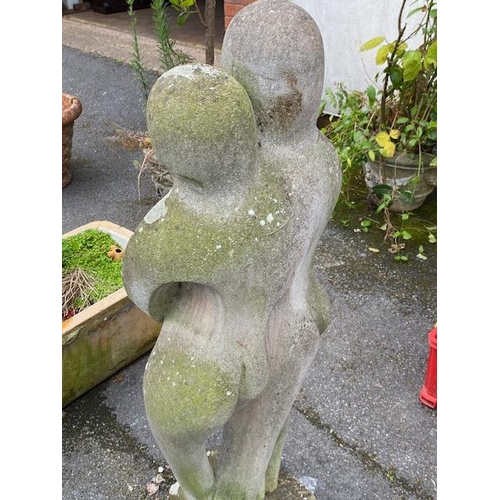 311 - Concrete garden statue in the style of Barbara Hepworth, of two figures embracing, approx 118cm tall