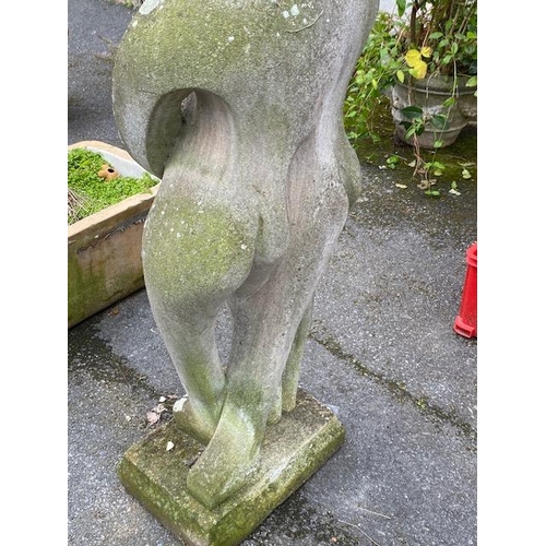 311 - Concrete garden statue in the style of Barbara Hepworth, of two figures embracing, approx 118cm tall