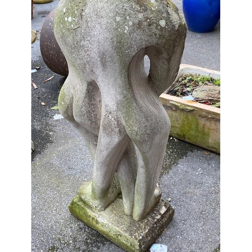 311 - Concrete garden statue in the style of Barbara Hepworth, of two figures embracing, approx 118cm tall