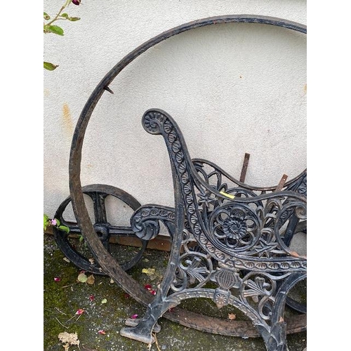 319 - Collection of garden metalware to include bench ends, wheels etc