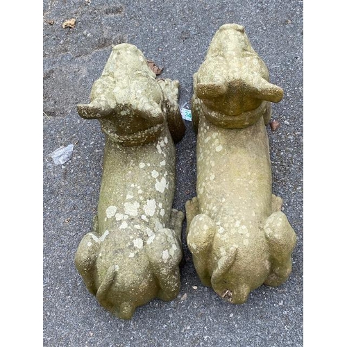 340 - Pair of composite garden dog ornaments