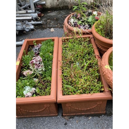 362 - Collection of eight terracotta style garden planters (plastic), including plants