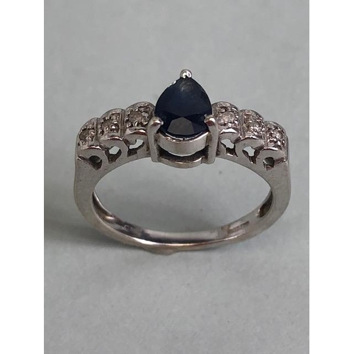 57 - 9ct white gold ring set with pear cut central sapphire and 6 diamonds on the shoulders approximately... 