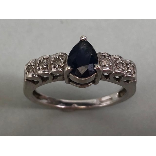 57 - 9ct white gold ring set with pear cut central sapphire and 6 diamonds on the shoulders approximately... 