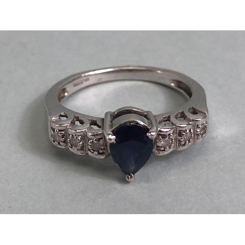 57 - 9ct white gold ring set with pear cut central sapphire and 6 diamonds on the shoulders approximately... 