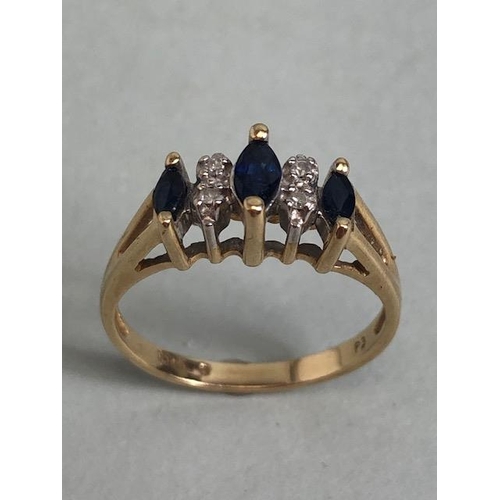 71 - Gold ring set with 3 marquise cut sapphires and 4 diamonds approximately size M and 2.3g