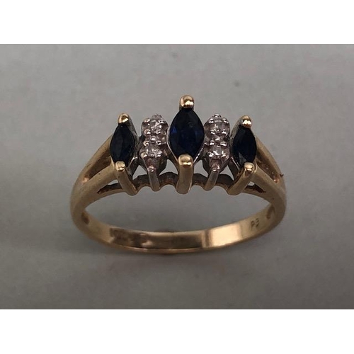 71 - Gold ring set with 3 marquise cut sapphires and 4 diamonds approximately size M and 2.3g