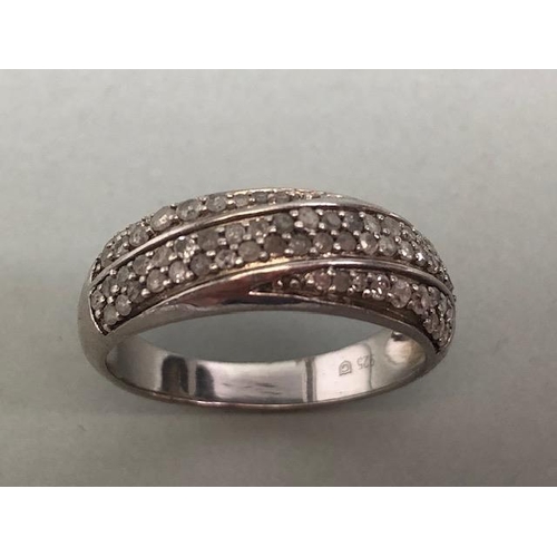 72 - Diamond pave set ring, 3 rows of round cut stones set in white metal stamped 925 G approximately siz... 