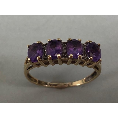 73 - 9ct gold ring set with 4 oval cut amethyst and 3 diamonds, approximately size P and 2g