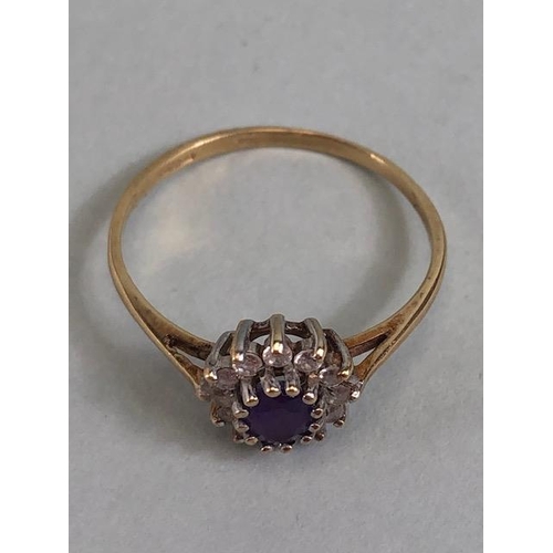 77 - 9ct gold ring set with a central amethyst surrounded by diamonds approximately size N and 1.2g