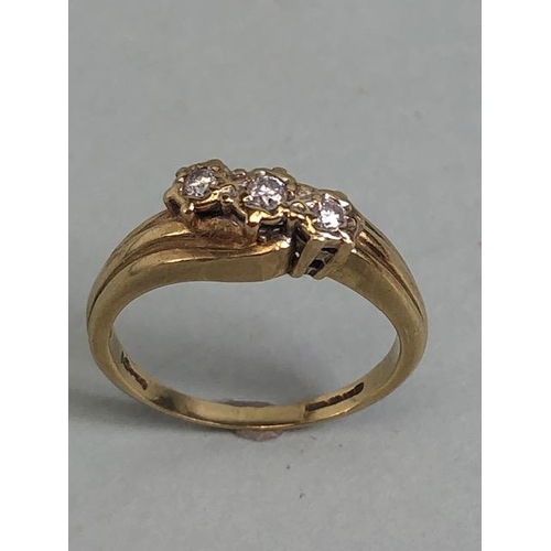 78 - 9ct gold ring set with 3 diamonds in a diagonal approximately size J and 2.2g