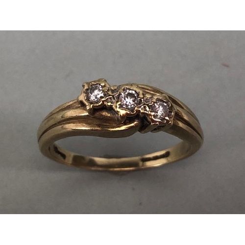 78 - 9ct gold ring set with 3 diamonds in a diagonal approximately size J and 2.2g