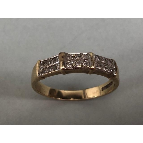 79 - 9ct gold ring set with 18 diamonds in a 3 panel setting approximately size N and 1.9g