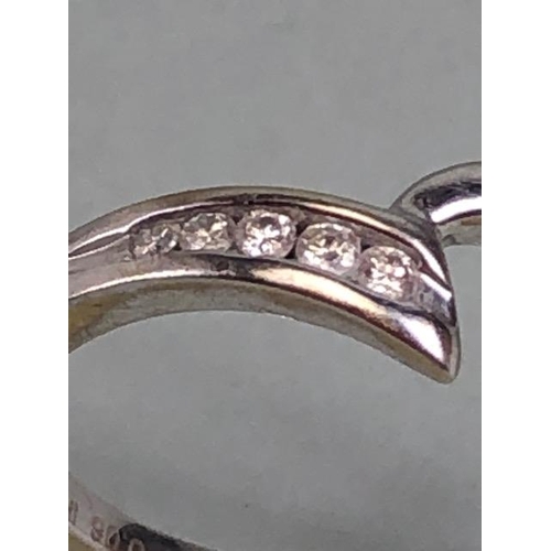 80 - 9ct white gold ring set with 5 round cut diamonds in an of set twist design approximately Size L and... 