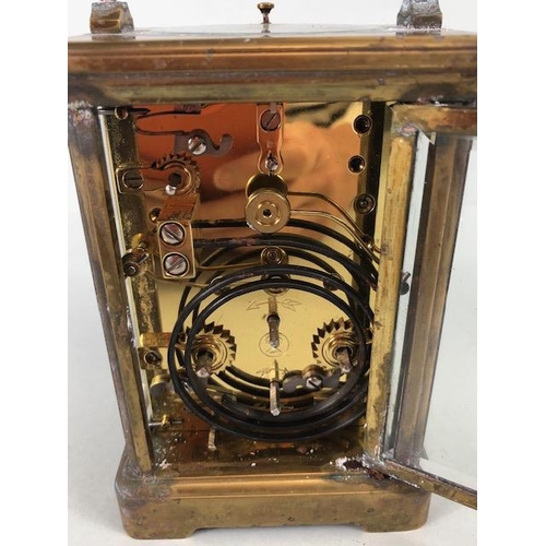 88 - Brass cased striking carriage clock  by Angelus Switzerland, brass case with glass panels, white fac... 