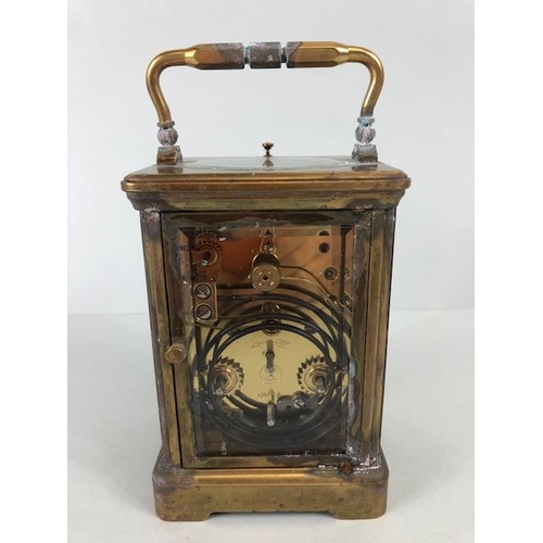 88 - Brass cased striking carriage clock  by Angelus Switzerland, brass case with glass panels, white fac... 