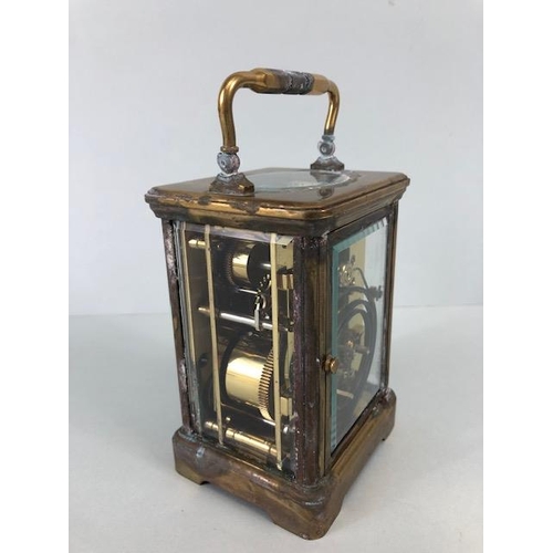 88 - Brass cased striking carriage clock  by Angelus Switzerland, brass case with glass panels, white fac... 