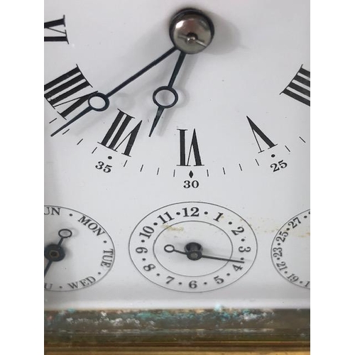 88 - Brass cased striking carriage clock  by Angelus Switzerland, brass case with glass panels, white fac... 