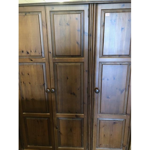 109 - Pine three Door wardrobe with shelves and hanging rail