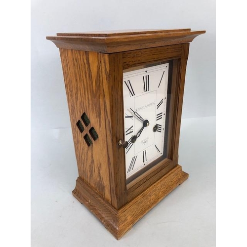 115 - Knight & Gibbins oak cased chiming mantel clock, white face with Roman numerals, approximately 27cm ... 