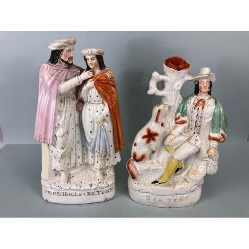 134 - Victorian Staffordshire Mantel figures, dog Tray and Prodigals return, both approximately 12 inches ... 