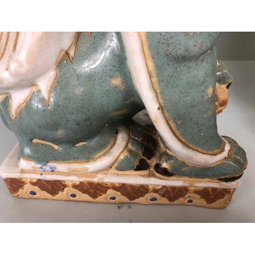 138 - Oriental Ceramics, Two Chinese pottery Foo or Shi Shi dogs glazed in celadon and cream each  approxi... 