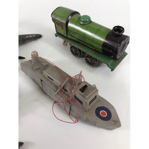 143 - Vintage toy and military interest, 2 war time scratch built carved fighter aircraft, a Royal Navy MT... 