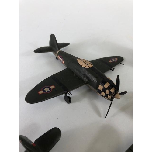 143 - Vintage toy and military interest, 2 war time scratch built carved fighter aircraft, a Royal Navy MT... 