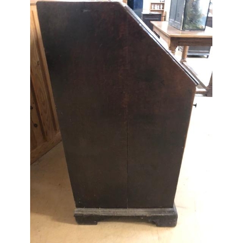 160 - Antique Georgian Oak Bureau with four drawers and fall front opening to pigeon holes and small drawe... 