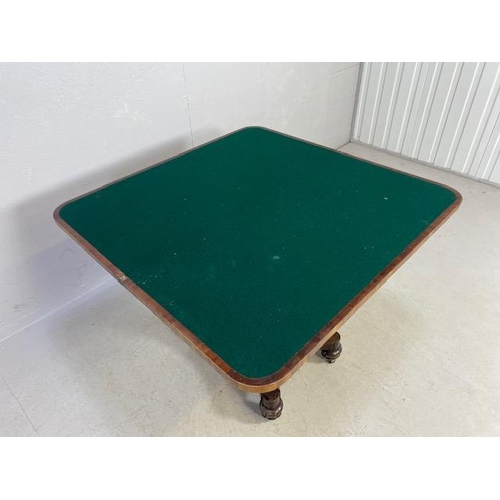 163 - Victorian folding games table on tapering octagonal pedestal with original casters and green baize, ... 