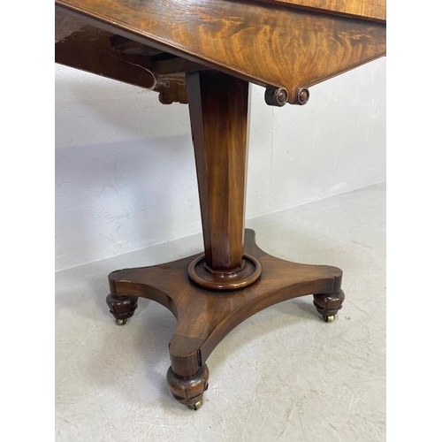 163 - Victorian folding games table on tapering octagonal pedestal with original casters and green baize, ... 