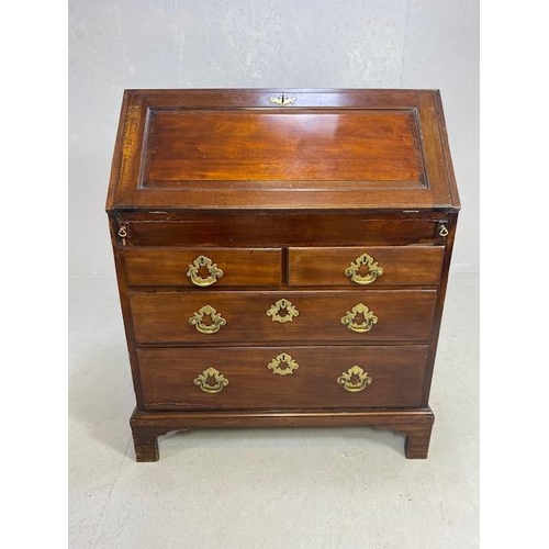 166 - Georgian Mahogany fall front Bureau with four drawers, Hidden compartments and brass fixtures