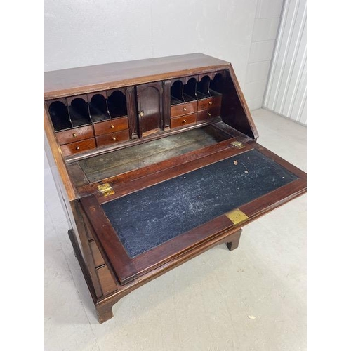 166 - Georgian Mahogany fall front Bureau with four drawers, Hidden compartments and brass fixtures