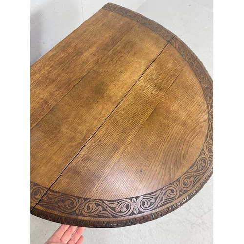 192 - Oak drop leaf table with carved edgework