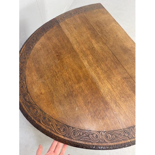 192 - Oak drop leaf table with carved edgework